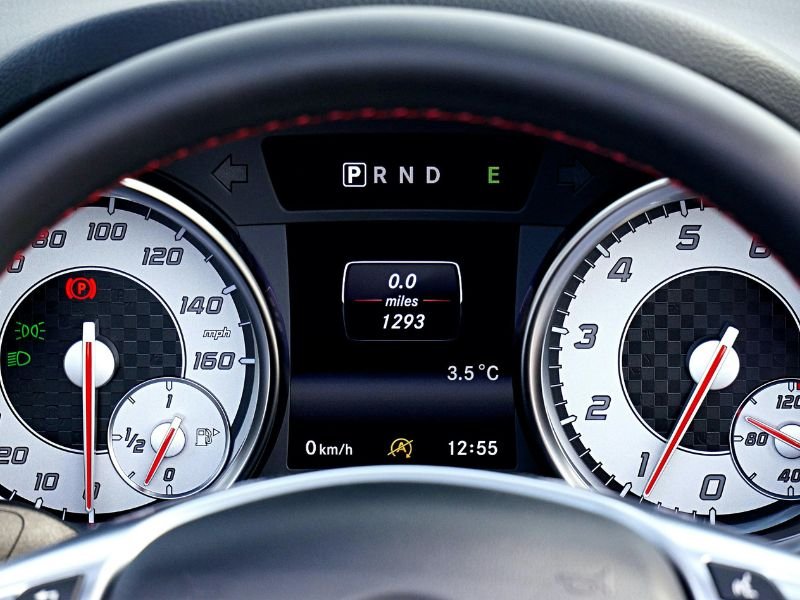 Toyota Camry hybrid driving in city showing fuel efficiency