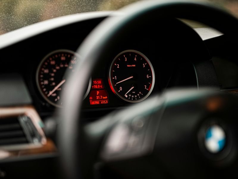 Toyota Crown hybrid driving in city traffic