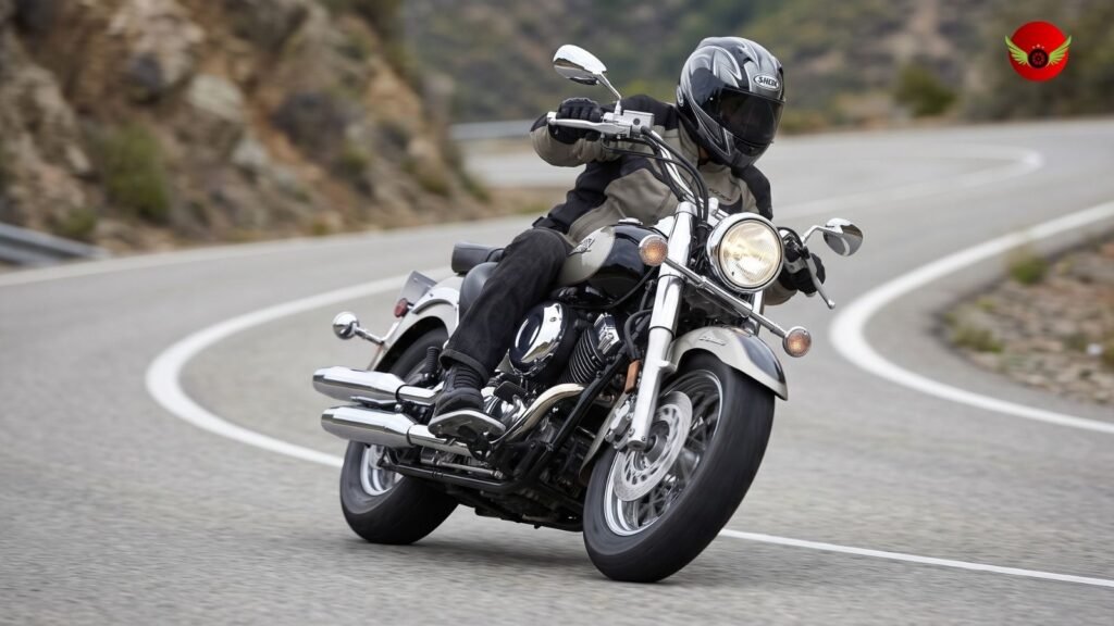 Yamaha V Star 1100 leaning through a wide mountain curve with stable cruiser handling.