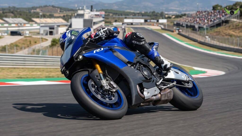 Yamaha YZF-R1M leaning through a fast corner to demonstrate handling and ride quality on a racetrack.