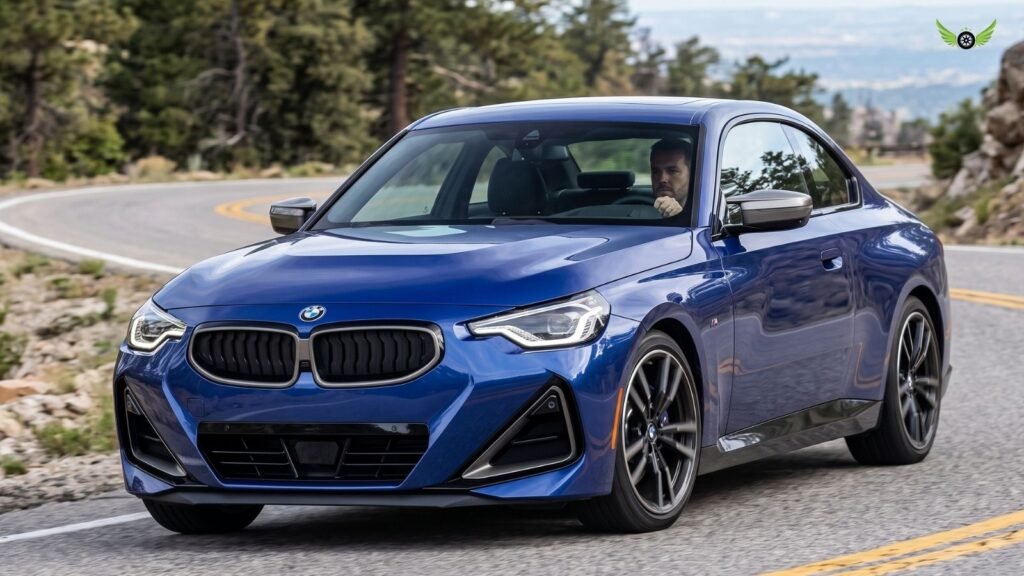 2026 BMW 2 Series Coupe driving on a winding road during real-world road testing
