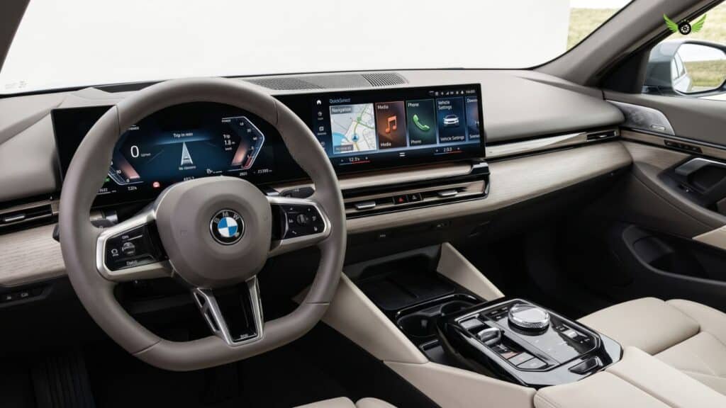 2026 BMW 5 Series interior with curved display and iDrive technology
