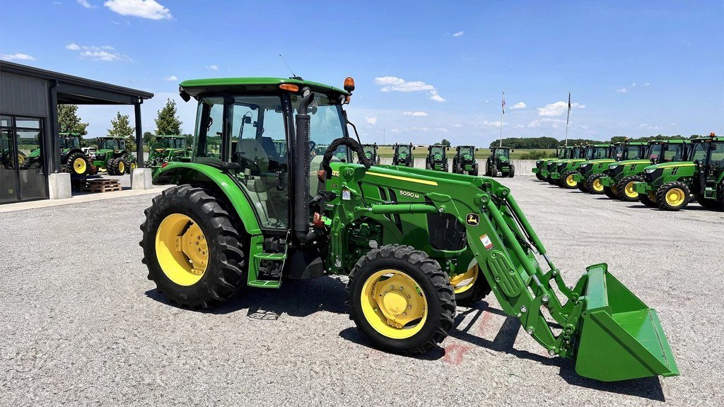 Clean John Deere 5090M on a dealership lot showing strong resale value