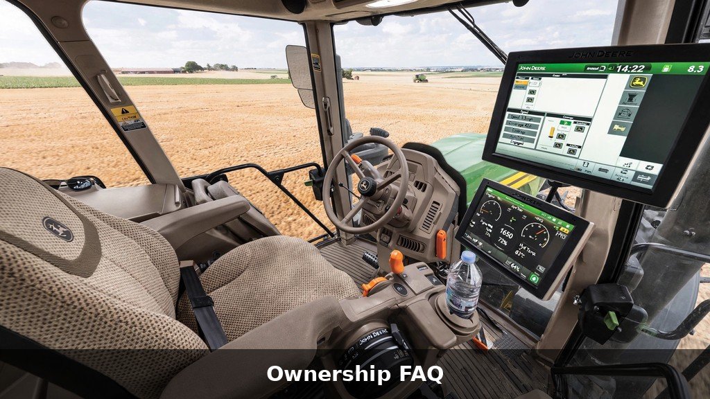 Modern John Deere tractor cab interior with controls and display