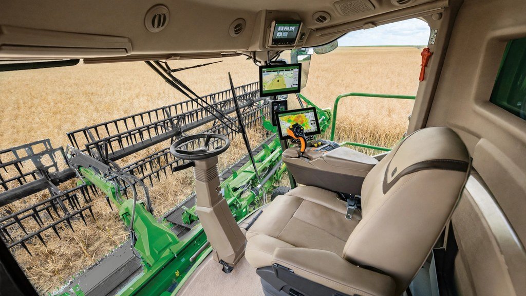 John Deere 9560 combine cab view during harvest - Vehicle Review Hub